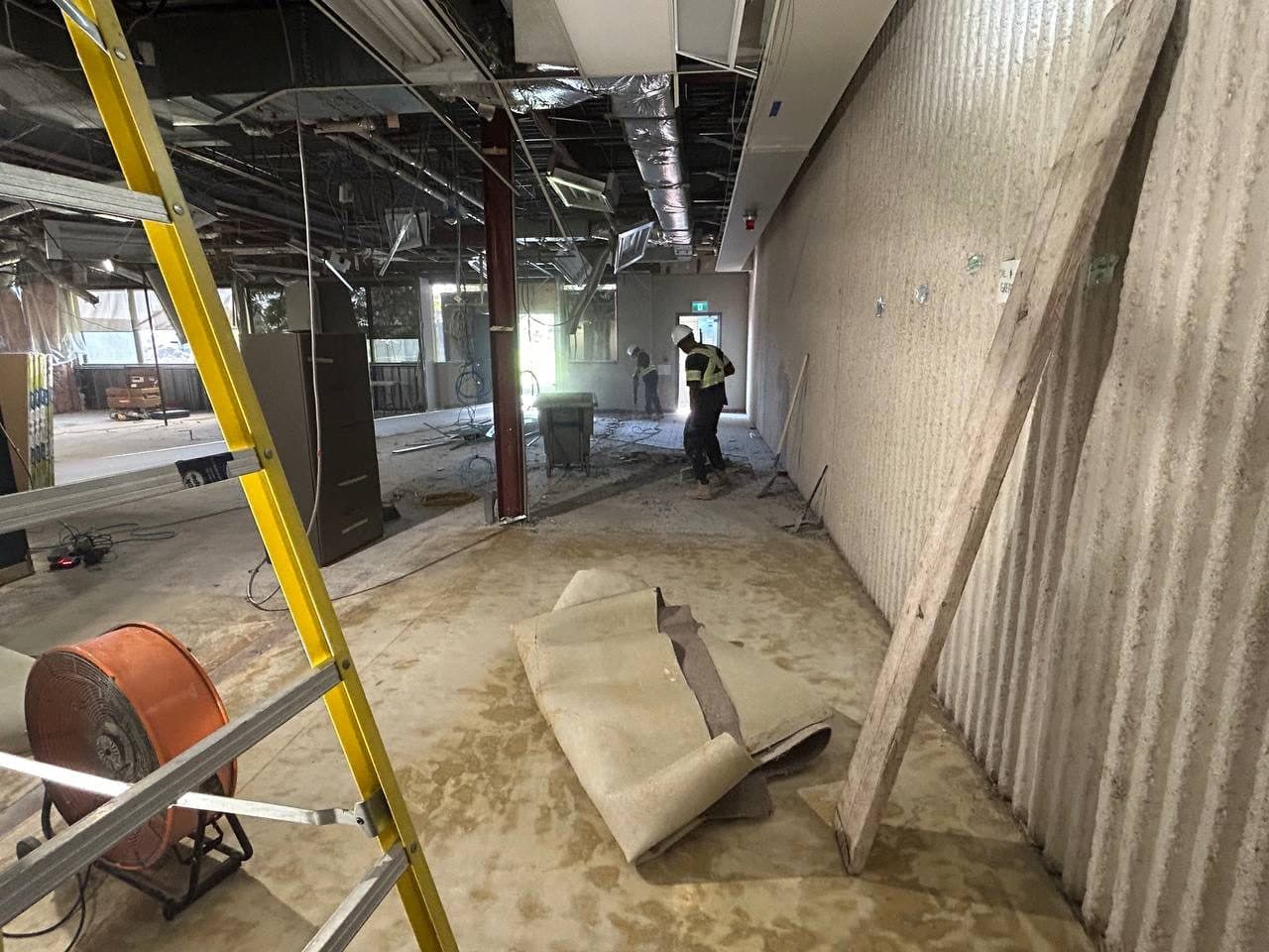 Duffin Creek lab interior stripped to the slab, with ceilings opened and flooring pulled up